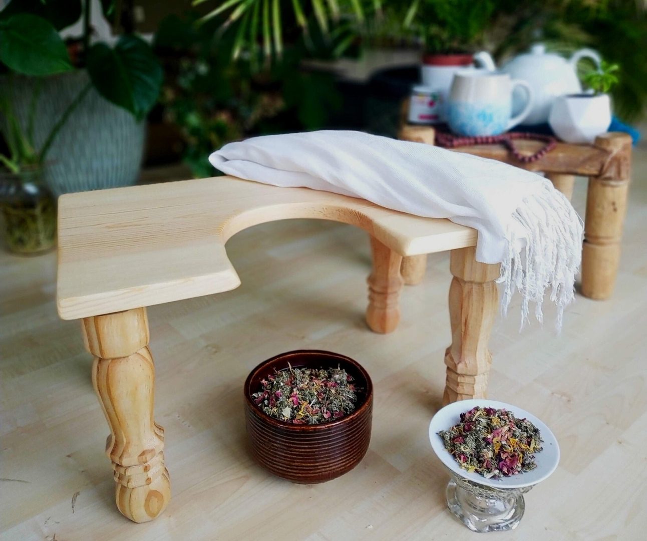 A table with two bowls and a towel on it